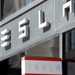 Tesla stock edges lower despite analyst upgrading profit estimates